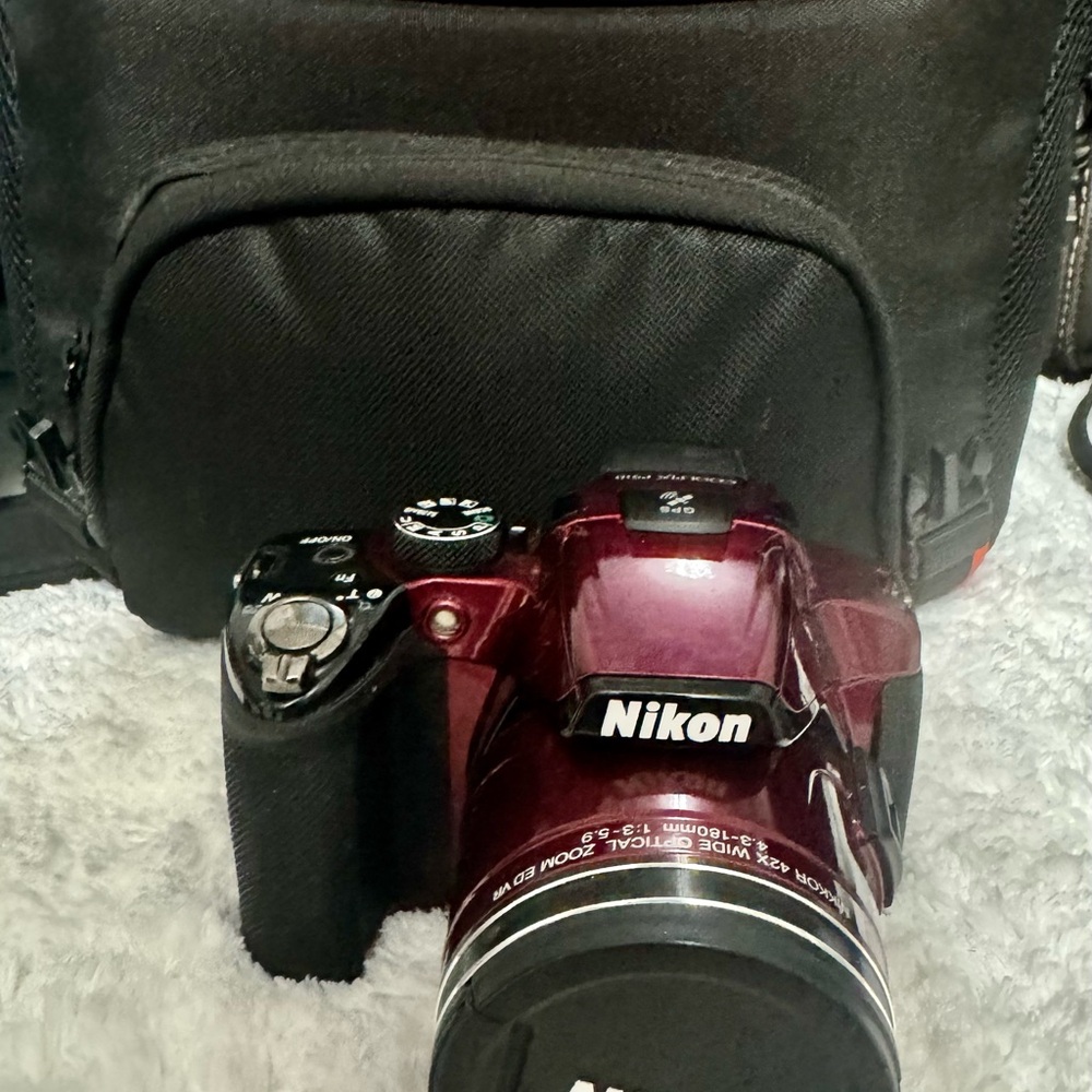 Nikon Red Digital Camera with Zoom Lens and Stylish Design